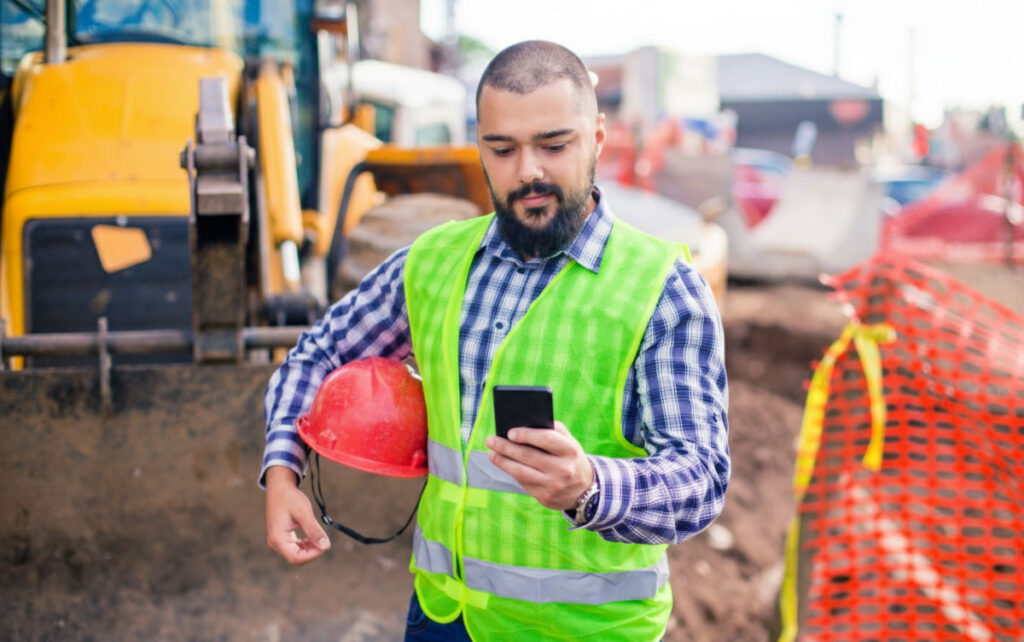 construction worker on phone